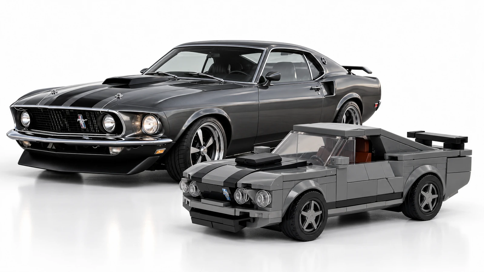 Dark grey 1969 Mustang Mach 1 beside its compatible brick-built display model.