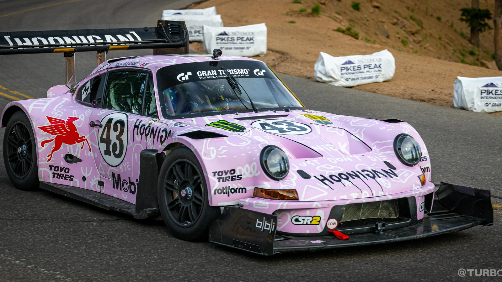 Action shot of the Hoonipigasus driving up the winding Pikes Peak mountain road during testing.