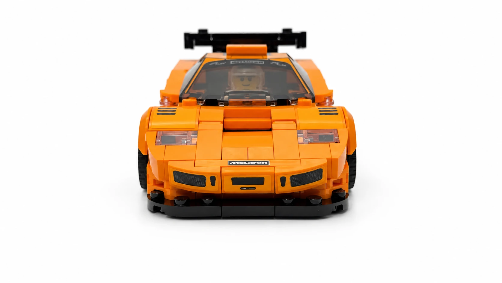 Orange brick-built display car photographed from the front