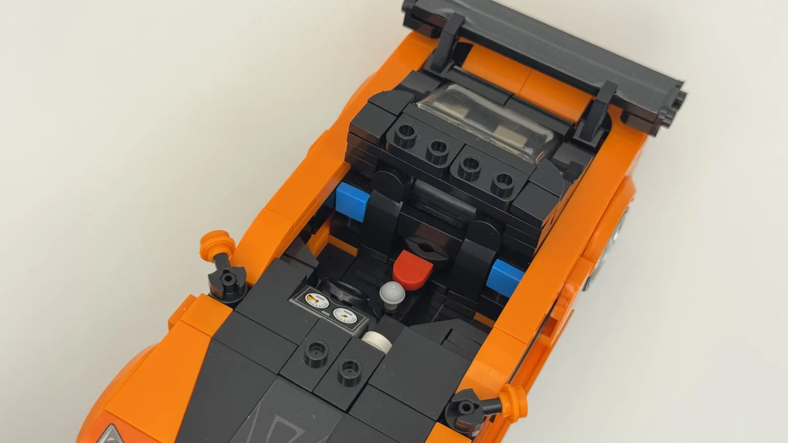 Top-down view of the Mazda RX-7 brick-built model showing its cockpit, instrument panel, gear selector and rear wing.